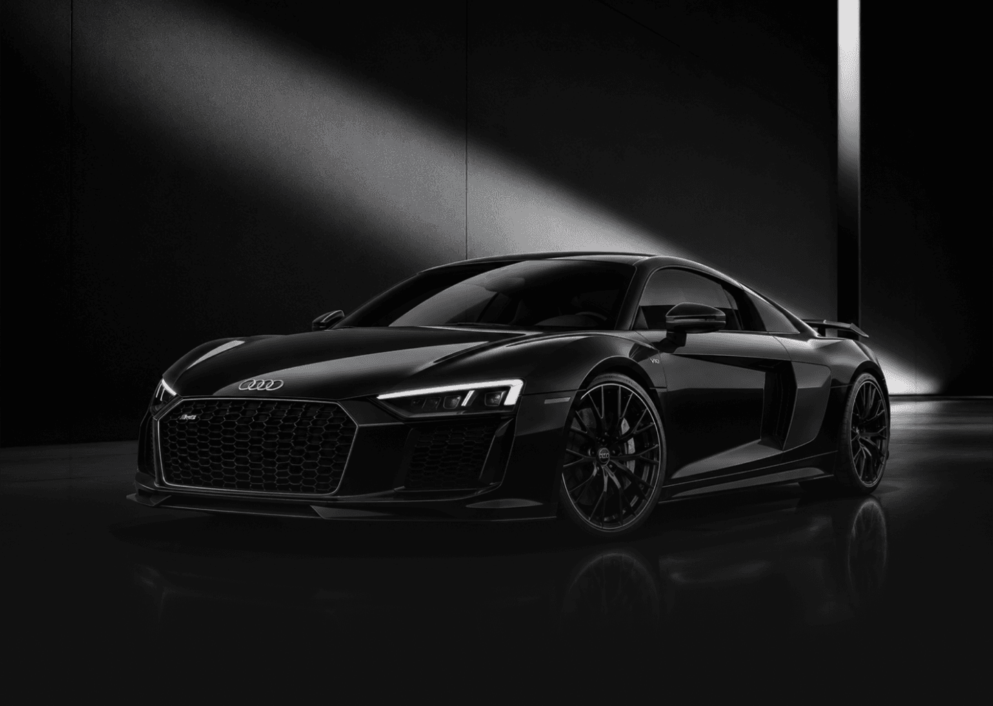 Luxury sports car in a dark automotive studio